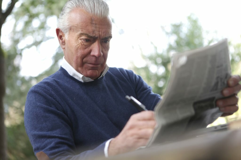 Information for the Aged Care Sector - Elderly man writing